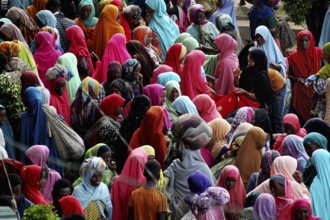Large crowd in colorful clothes at a market in Awaday, Awaday, Ethiopia