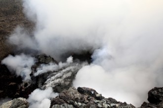 Smoke and steam rise from the crater of a volcano, Erta Ale, Ethiopia