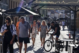 Vilnius Gatve in Kaunas with passers-by and cyclists in the summer sun, Kaunas, null, Lithuania