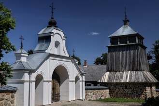 Church with wooden bell tower and gate in the open-air museum, Rumsiskes, Kauno apskritis,