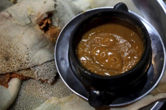 Traditional Ethiopian dish with injera and a bowl of stew at the Lalibela restaurant