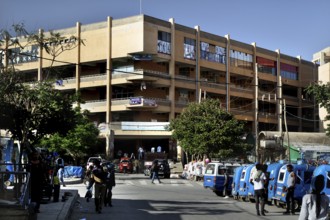 Busy road scenario in front of a large building, Mekele, Ethiopia