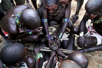 Group of Hamers gathers closely during a traditional initiation ritual, Turmi, null, Ethiopia