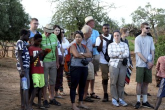 Group of tourists observes the Hamer initiation ritual with interest and curiosity, Turmi, null,
