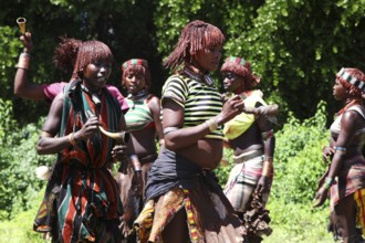 In Turmi, Hamer woman dance together energetically in a solemn initiation ceremony, Turmi, Ethiopia
