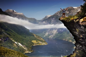 Spectacular views of the Geiranger Fjord from Flydalsjuvet with snow-capped peaks and deep water