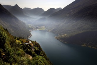 View of Geiranger and a picturesque fjord landscape from the Ørnevegen Serpentine Road, Geiranger,