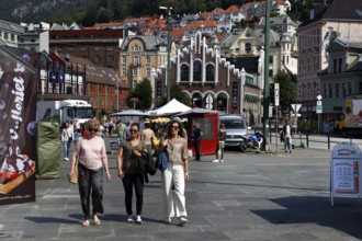 People walking through a busy street in Bergen in sunny weather, Bergen, Norway