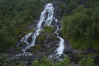 Summer day visiting Espelandsfossen falls near Bergen, scenic nature and flowing water, Vestland,