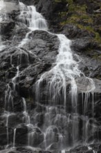 Summer day visiting Espelandsfossen falls near Bergen, scenic nature and flowing water, Vestland,
