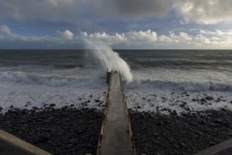Pier during storm, bridge with waves, Atlantic Ocean, Madeira, Portugal