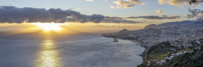 Sunset over the Atlantic Ocean, harbour with cruise ships, Funchal, Madeira, Portugal