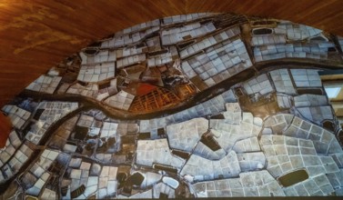 Anana salt pans filling a valley, creating a textured landscape of geometric shapes and water