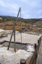 Ancient terraced salt pans extracting salt from brine, showcasing a traditional and historical