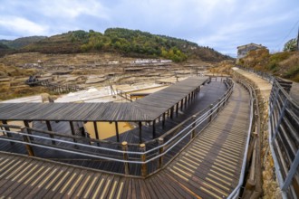 Salt evaporation ponds filling the salt valley of anana, showing traditional brine extraction