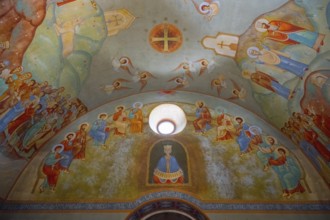 Symbolic frescoes in a church depicting saints and biblical scenes around the entrance, Kvemo Mleta