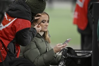SKY presenter reporter Nele Ocik formerly Schenker with smartphone cell phone, gets makeup