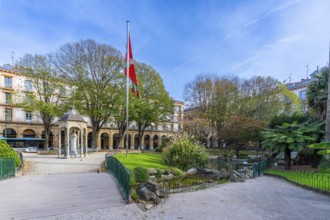 Gipuzkoa square in san sebastian showing the euskadi flag flying above the historic fountain and