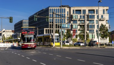 Berlin road traffic with buses, trams and pedestrians at and around the main train station, Berlin,