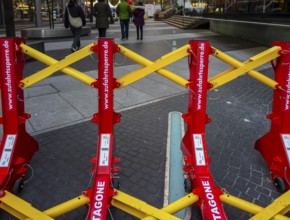 Massive metal access barriers in red and yellow at Center Potsdamer Platz, Berlin, Germany