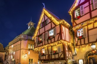 Colourfully illuminated and Christmassy decorated half-timbered houses, old town, blue hour,