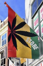 Flag with marijuana leaf at a cannabis shop in the pedestrian zone of The Hague, South Holland