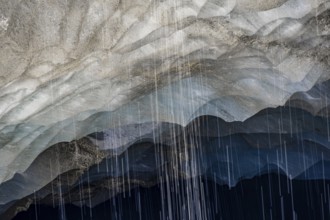 Meltwater at a glacier cave, underground glacier stream, Castner Glacier, Delta Range, Alaska
