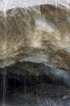 Meltwater at a glacier cave, underground glacier stream, Castner Glacier, Delta Range, Alaska