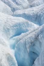 Waterfall in a crevasse on the ice of Root Glacier, Wrangell St. Elias National Park, Alaska, USA
