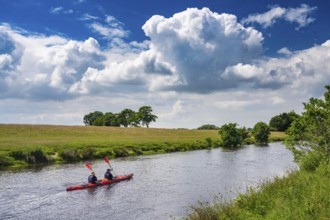 Canoeists do water sports on the Hunte near Astrup, Barneführer Holz, Wardenburg, Lower Saxony,