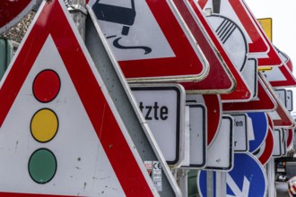 Storage for traffic signs in the yard of a road maintenance department, various signs with