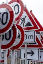 Storage for traffic signs in the yard of a road maintenance department, various signs with