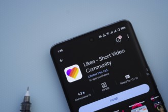 Dhaka, Bangladesh- 29 May 2025: On a blue surface, a smartphone displays the Likee app within the