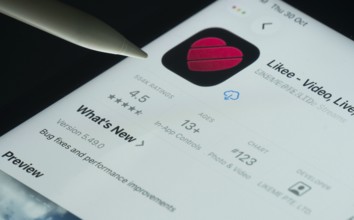 Dhaka, Bangladesh- 30 Oct 2025: Likee app on a iPad screen with a pen pointing at the install