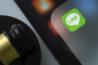 Dhaka, Bangladesh- 17 March 2025: A close up of an iPad screen displaying the LINE app alongside a