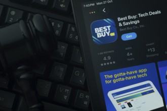 Dhaka, Bangladesh- 28 Oct 2025: An iPad displaying the Best Buy app against a judge's gavel and