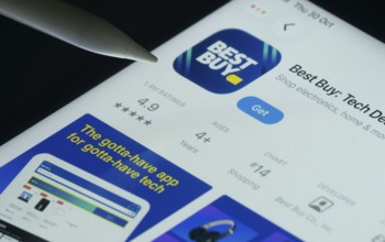 Dhaka, Bangladesh- 30 Oct 2025: Best Buy app on a iPad screen with a pen pointing at the install