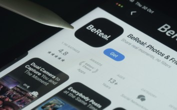 Dhaka, Bangladesh- 30 Oct 2025: BeReal app on a iPad screen with a pen pointing at the install