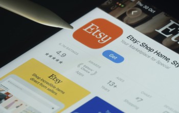 Dhaka, Bangladesh- 30 Oct 2025: Etsy app on a iPad screen with a pen pointing at the install option