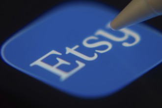 Dhaka, Bangladesh- 06 Dec 2025: Close-up of the Etsy Seller app on a screen with a stylus pointing