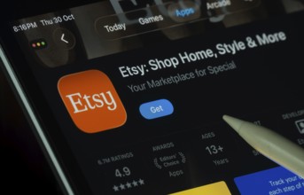 Dhaka, Bangladesh- 30 Oct 2025: Etsy app displayed on a iPad screen in dark mode with a digital pen