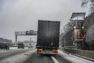The onset of winter in North Rhine-Westphalia, heavy snowfall, driving on the A3 motorway near