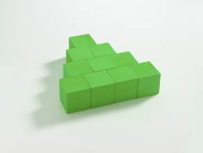 10 green wooden cubes against a white background