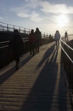 Walkers, tourists on hiking trail, Þingvellir National Park, impressive Almannagja Gorge,