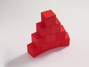 10 red wooden cubes against a white background