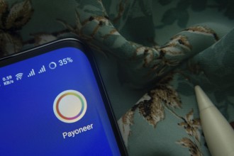 Dhaka, Bangladesh- 07 May 2025: Payoneer app icon is seen on smartphone