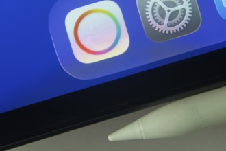 16 Nov 2025- Dhaka, Bangladesh: Payoneer and other app icons with a digital pen on a iPad screen