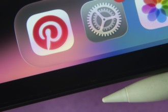 16 Nov 2025- Dhaka, Bangladesh: Pinterest and other app icons with a digital pen on a iPad screen