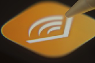 Dhaka, Bangladesh- 06 Dec 2025: Close-up of the Audible app on a screen with a stylus pointing at