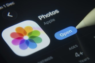 Dhaka, Bangladesh- 01 Dec 2025: A close-up of the Apple Photos app icon in the App Store on an iPad